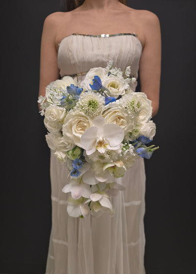 wedding Bouquet of white and blue flowers bride bridal orchids scabiosa roses delphinium