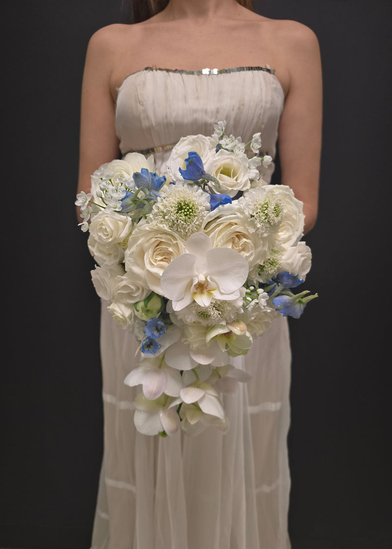 wedding Bouquet of white and blue flowers bride bridal orchids scabiosa roses delphinium