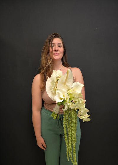 woman holding orchid bouquet bridal wedding